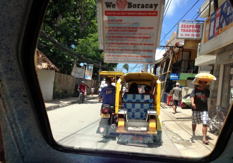 Taking the tricycle from the jetty on Boracay to our accommodation by White Beach