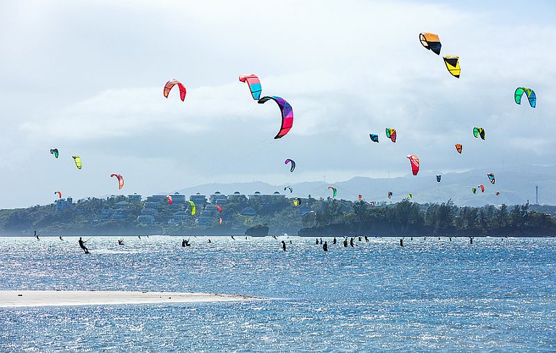 Kitesurfers enjoying wind power on Bulabog beach, Boracay island